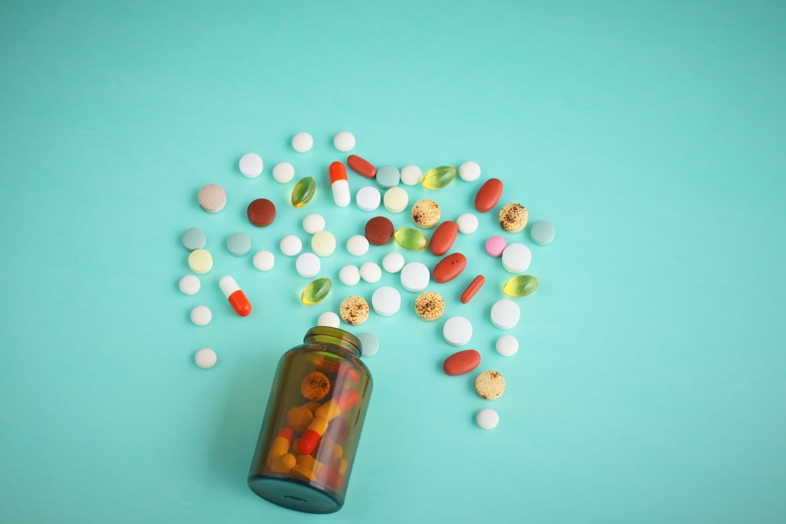 Medications spilling out of a bottle