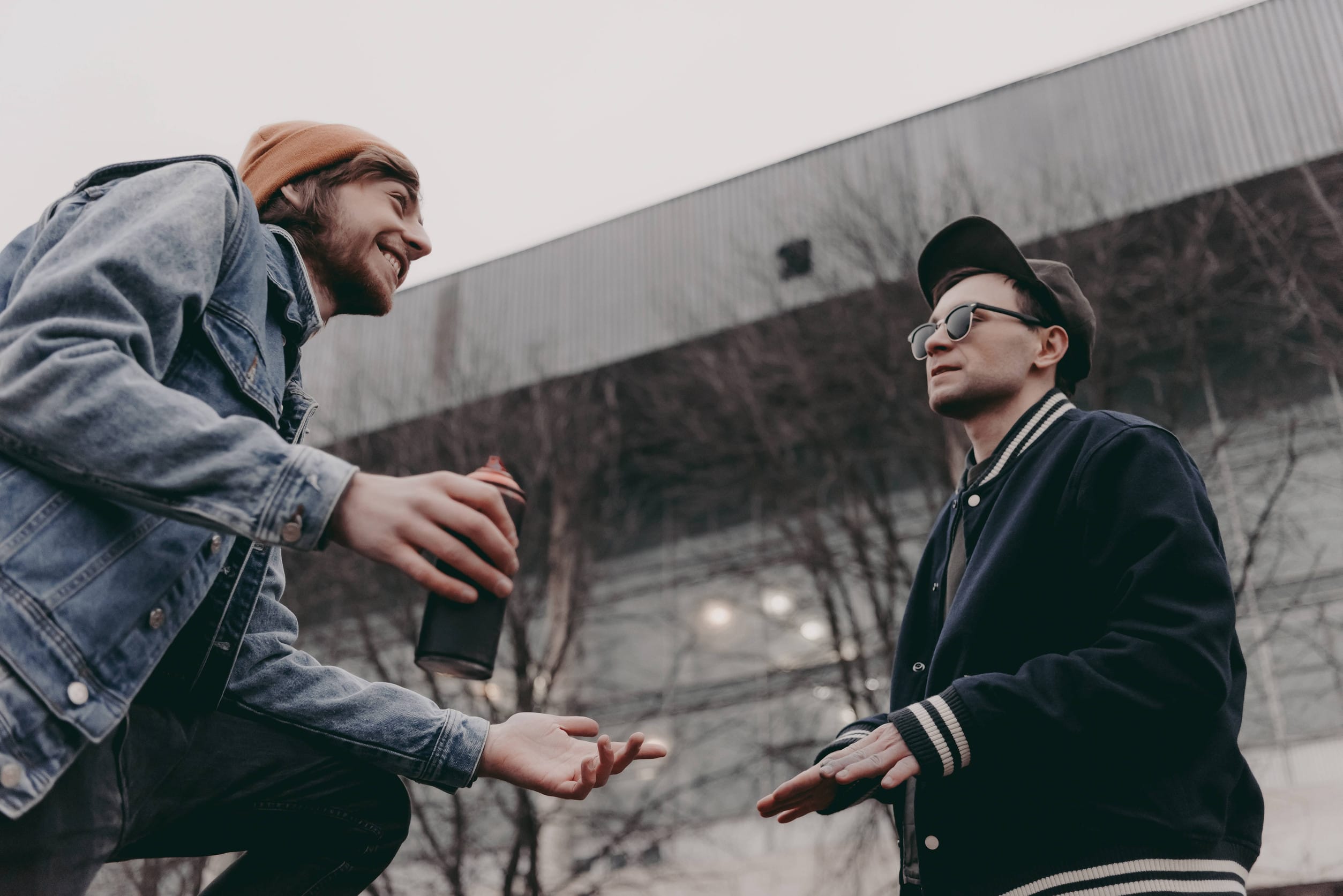 two male friends smiling and chatting