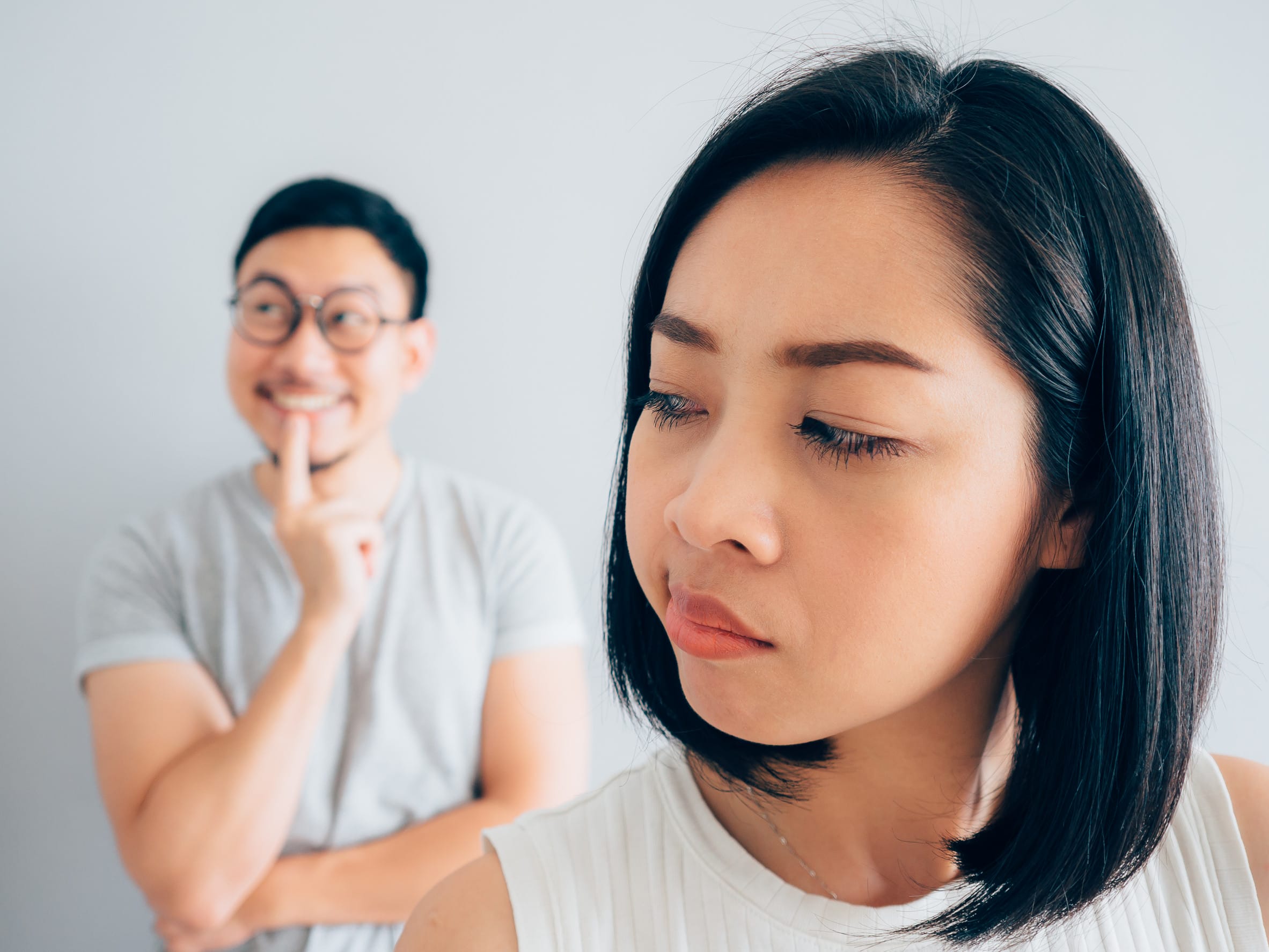 Annoyed wife and funny tricky husband.