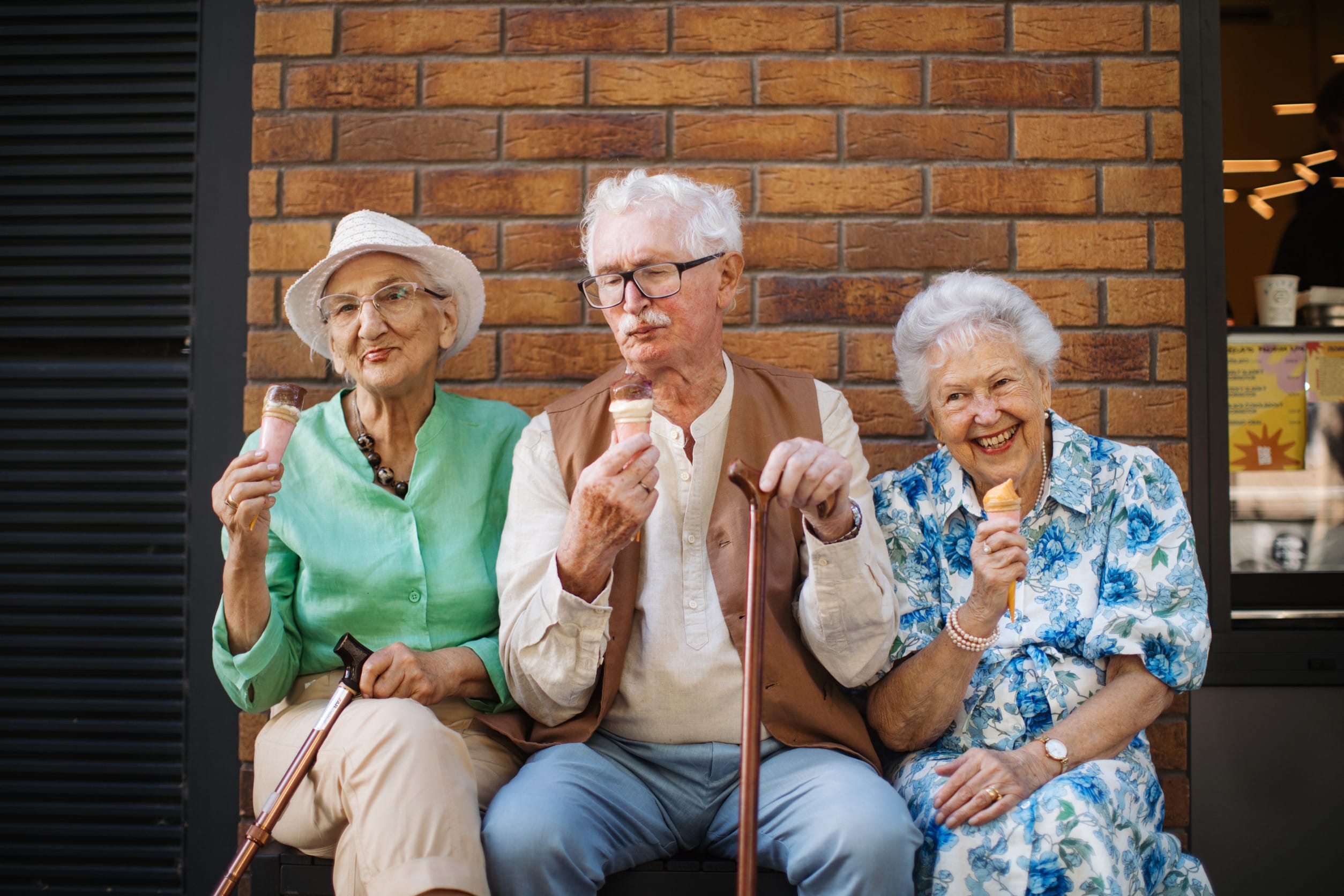 A group of senior citizens enjoing ice cream together, possibly with a discount