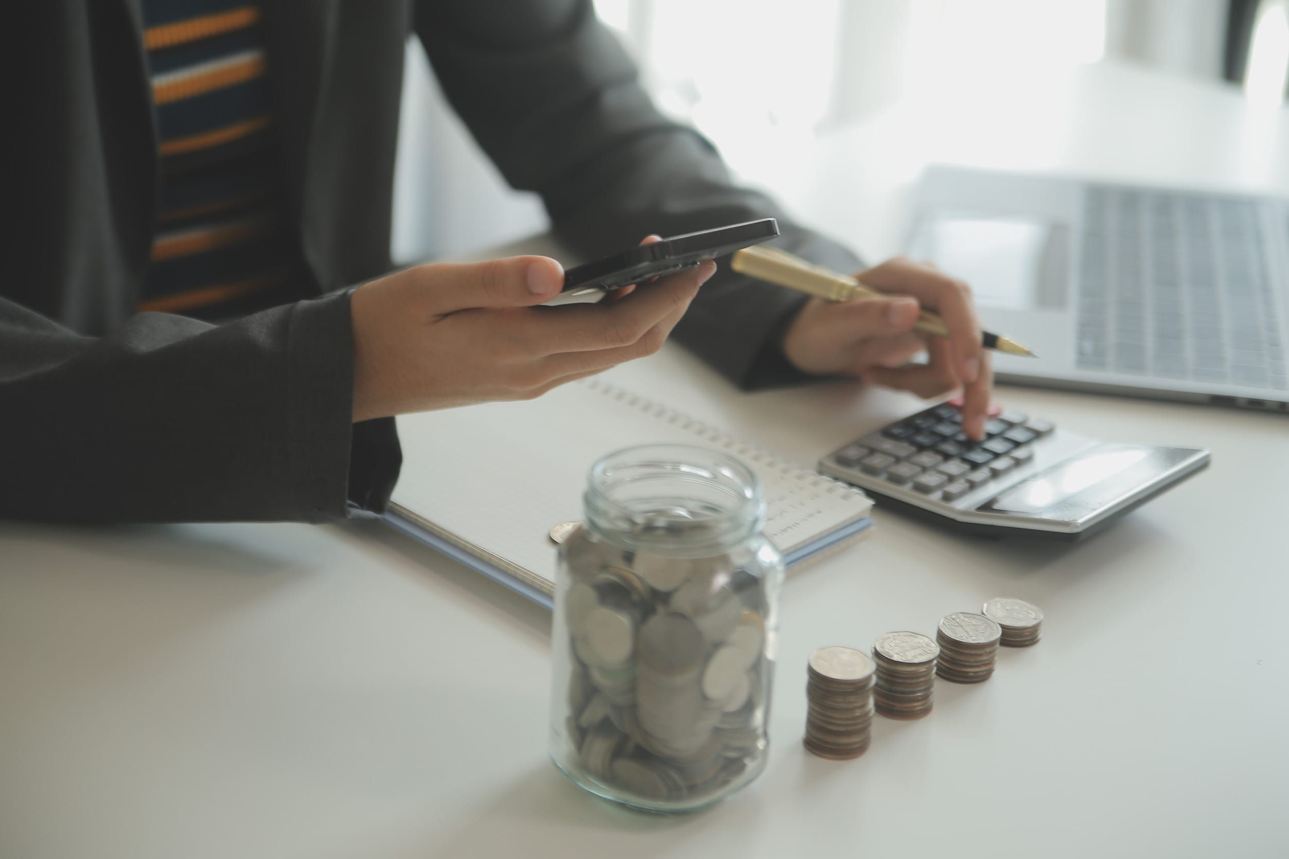 Someone tracking spending and managing their cash flow