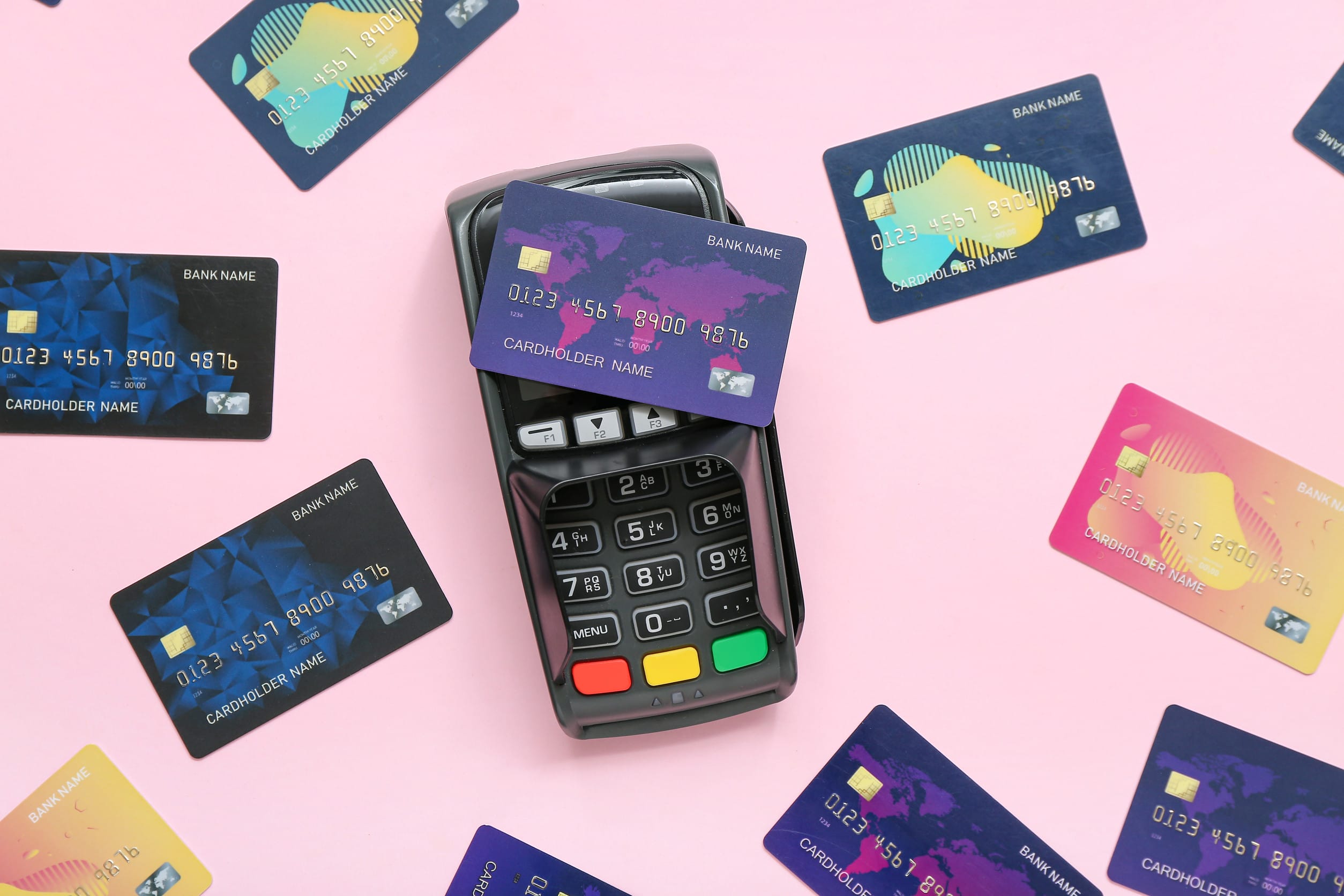 Credit cards next to a payment terminal