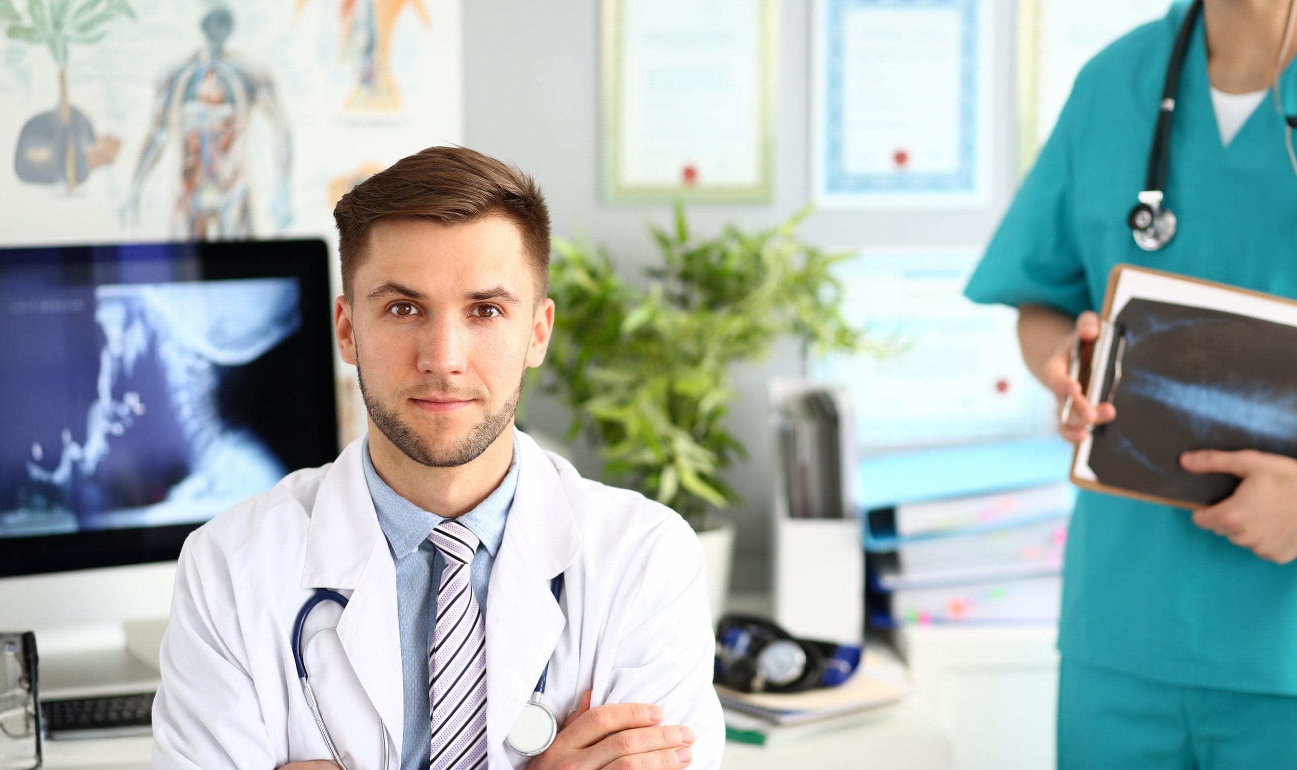 A young doctor at his office