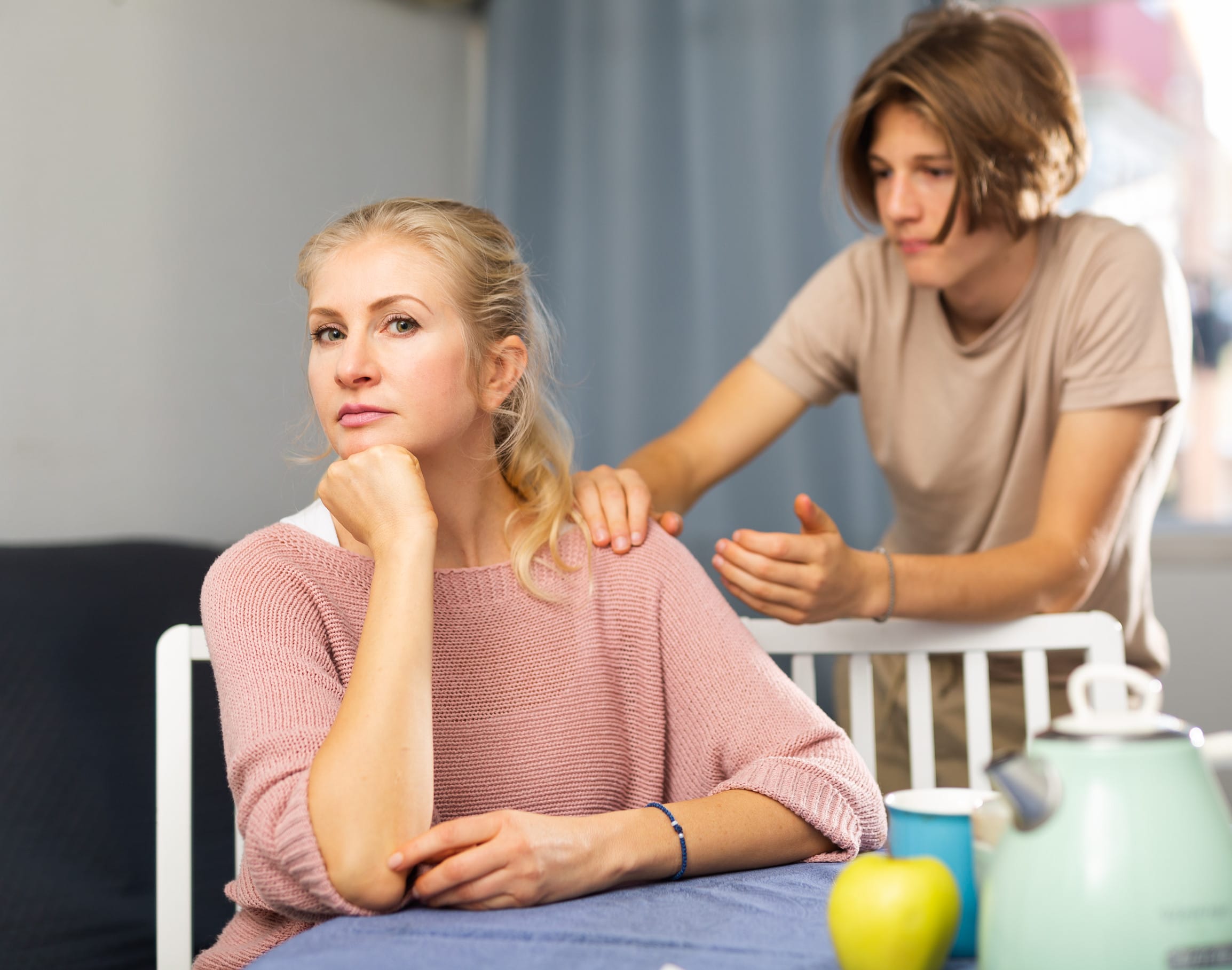 A teenage son thinking about apologizing to his parents