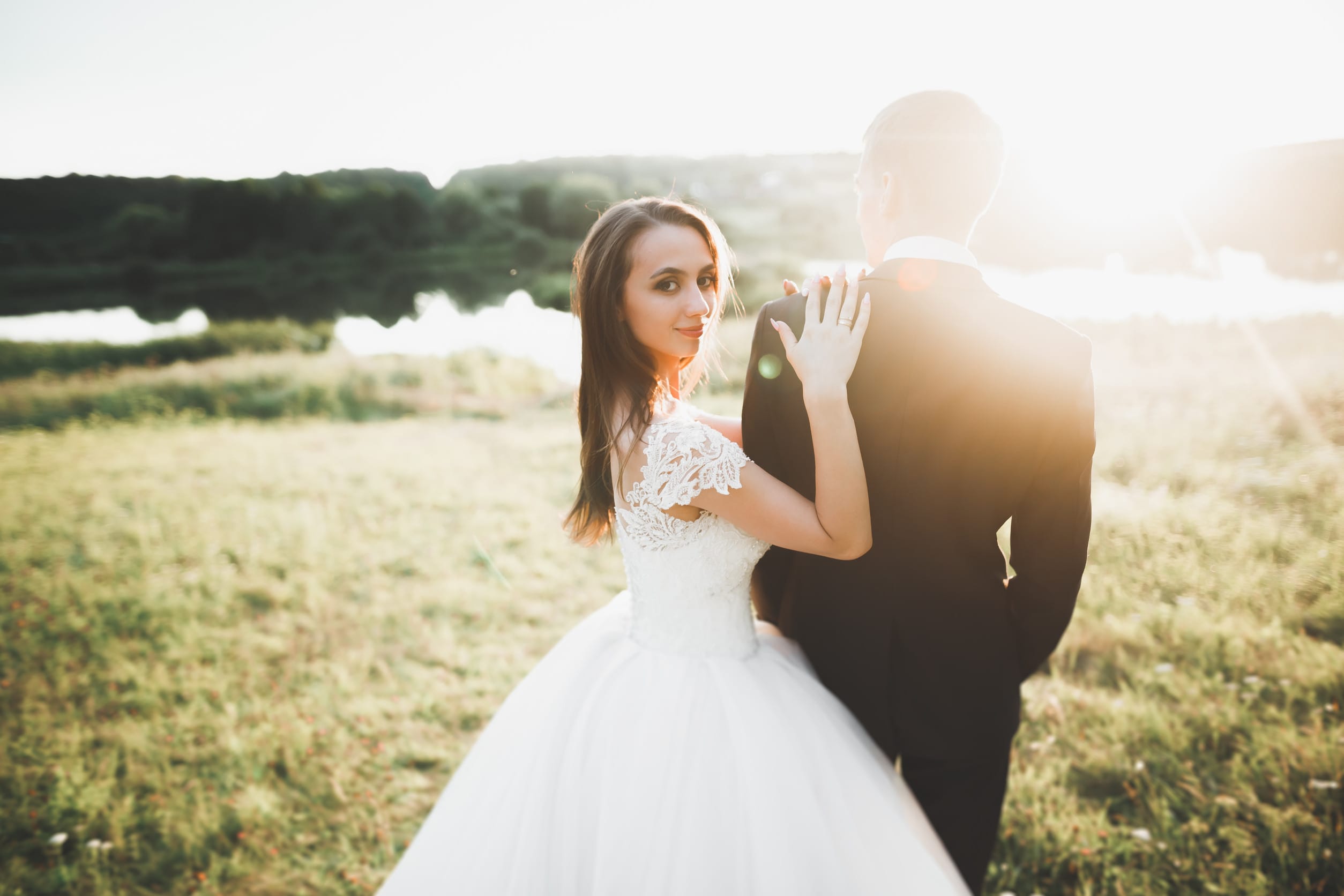 A man and woman getting married, which is a reason to change estate planning ideas