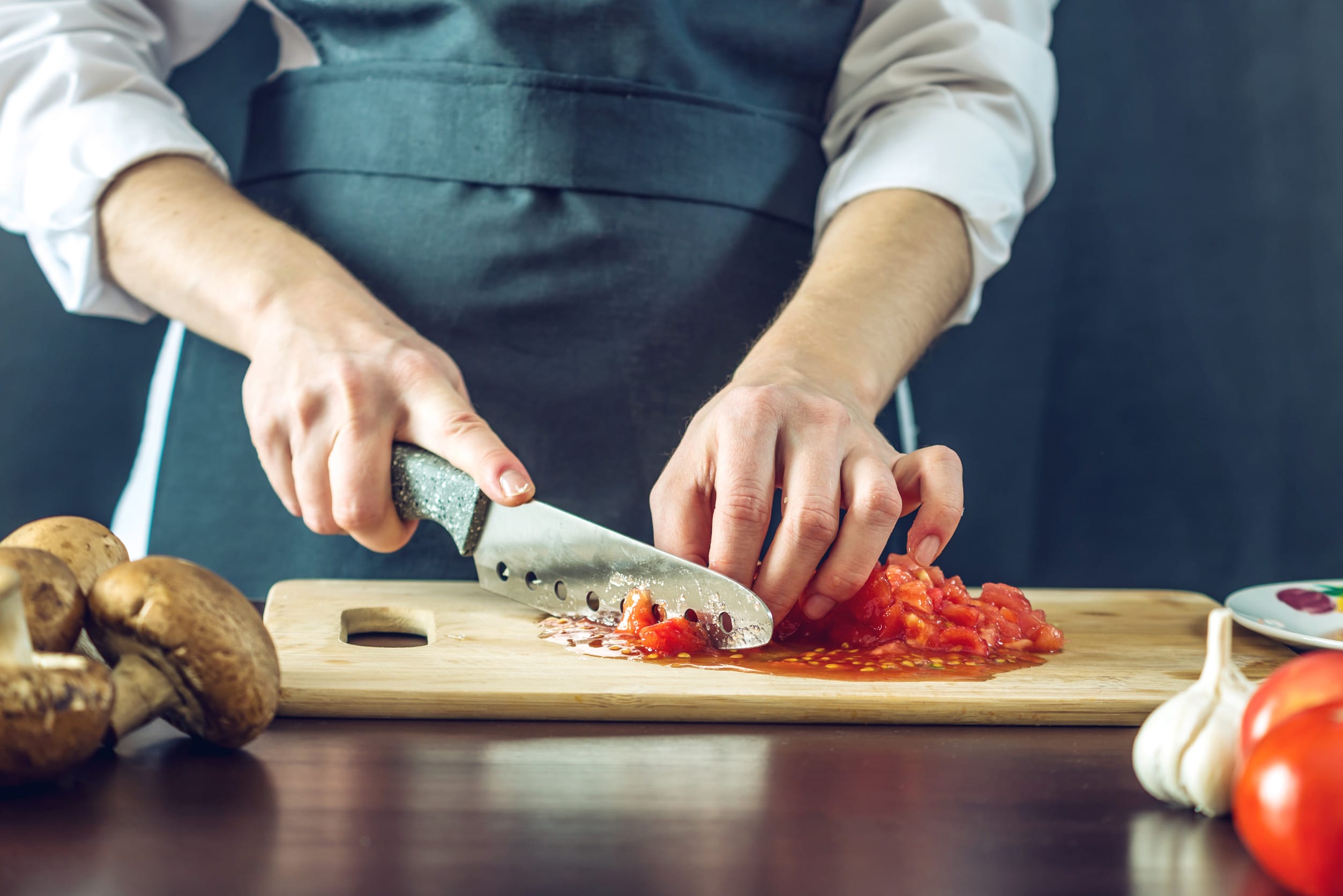 Slicing tomatoes on a cutting board