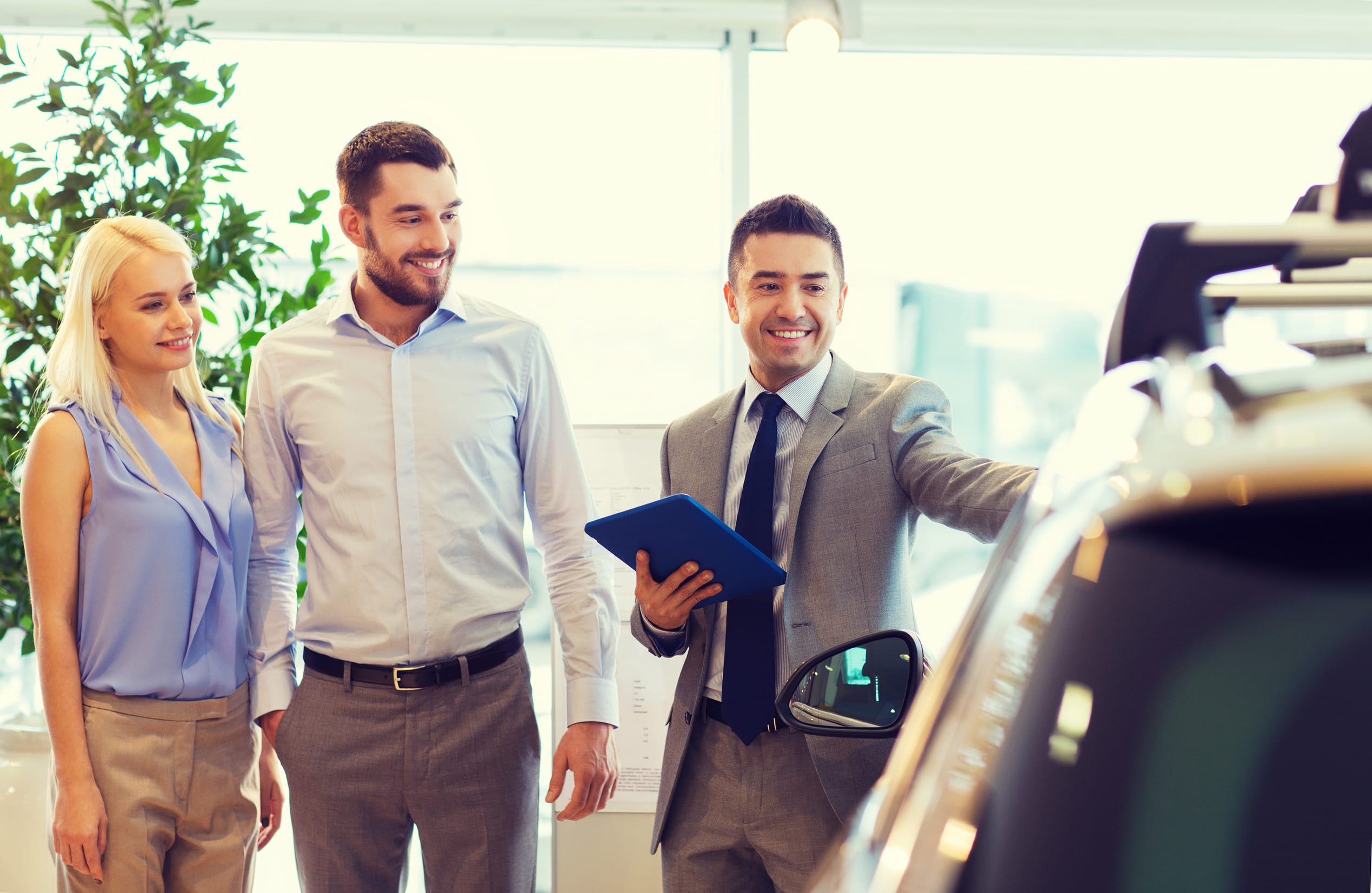 Young lady at dealership getting a car