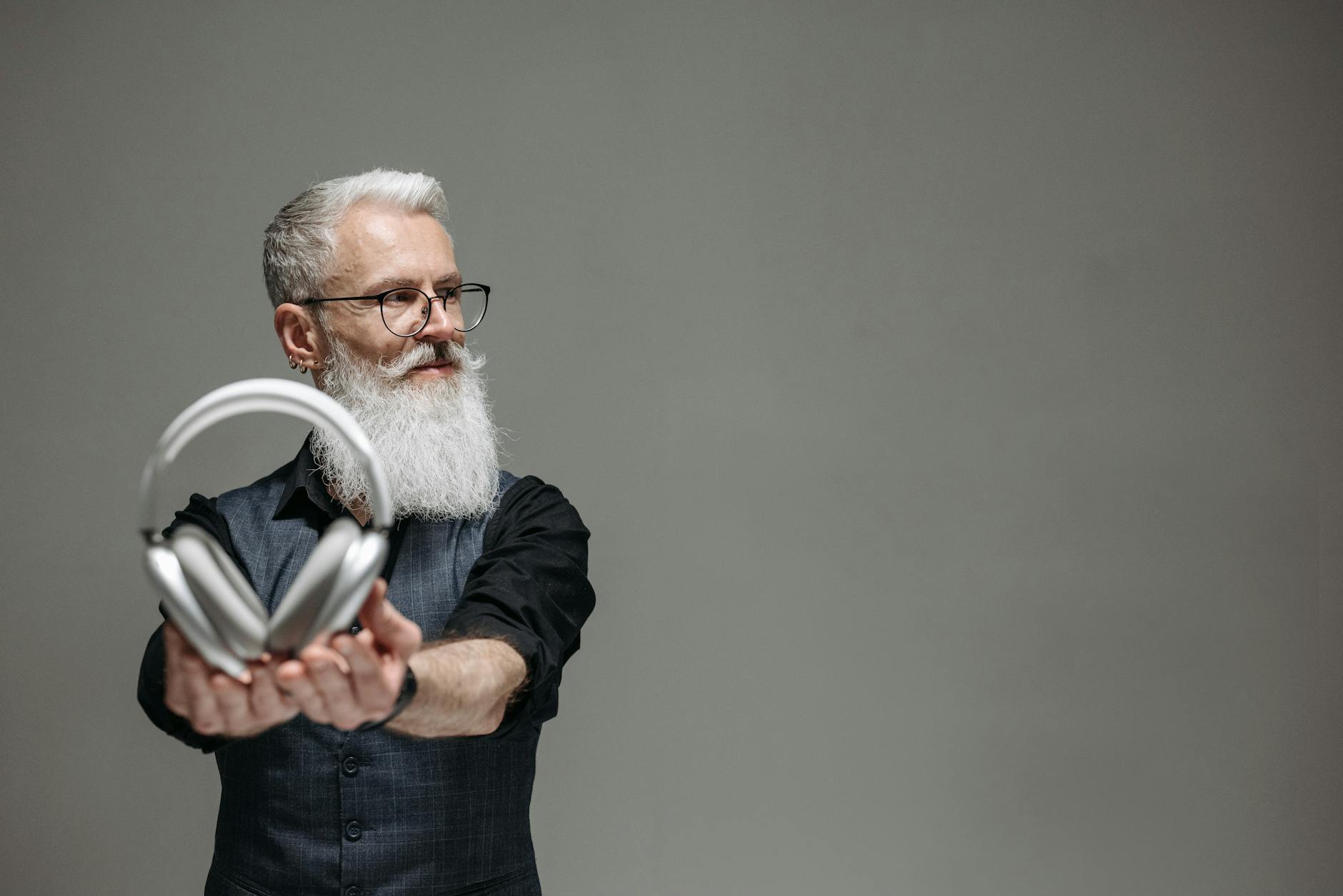 man holding headphones