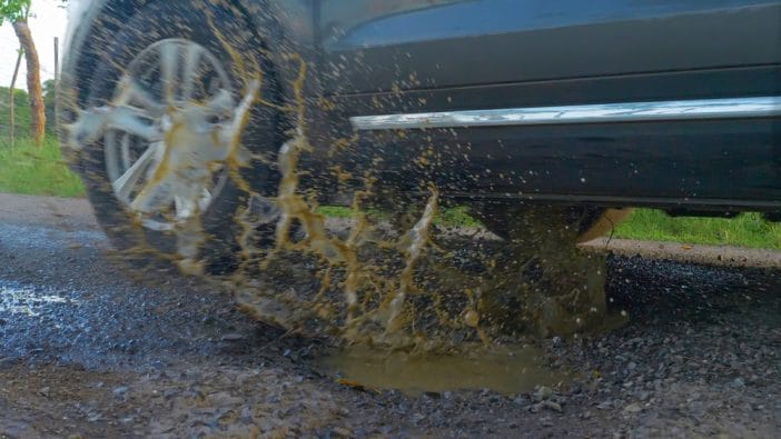 The $1,200 Suspension Repair Insurance Denies as "Wear and Tear" After Potholes